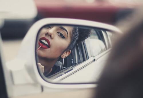 Photo in the Rearview Mirror of the Car